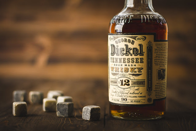 whiskey bottle and stones